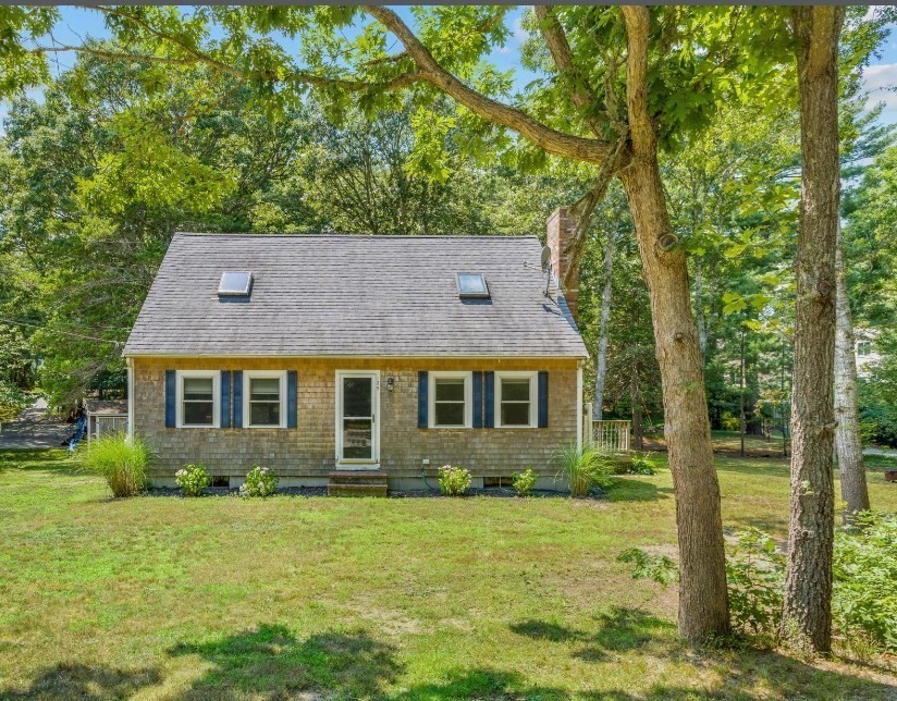 front view of a house with a yard