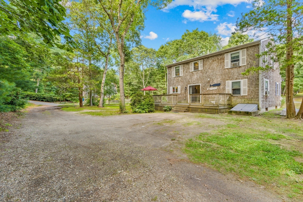125 St Marks Road Falmouth, MA 02536 - Photo 29 of 31 a view of a house with backyard and trees