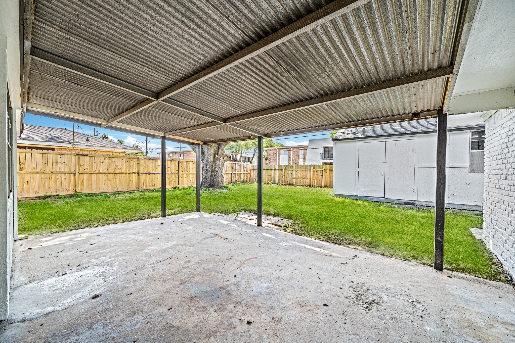 111 Princess Drive Houston, TX 77034 - Photo 25 of 30 a view of a backyard with wooden fence
