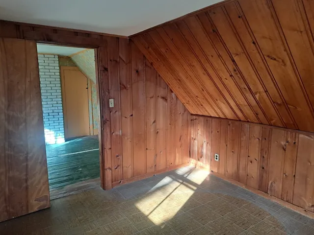 an empty room with a fan