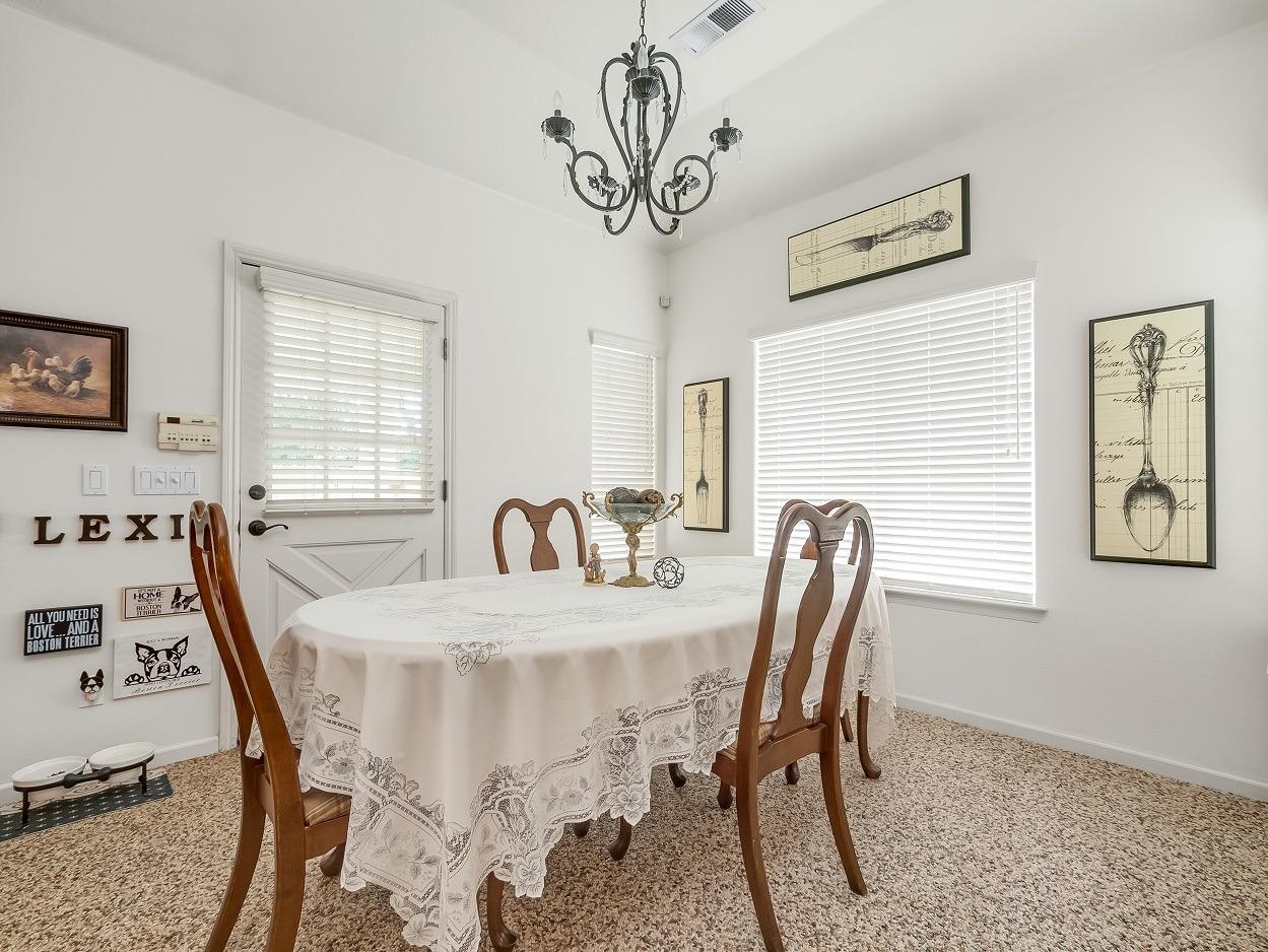 602 Fallbrook Avenue Clovis, CA 93611 - Photo 12 of 51 a view of a dining room with furniture window and wooden floor