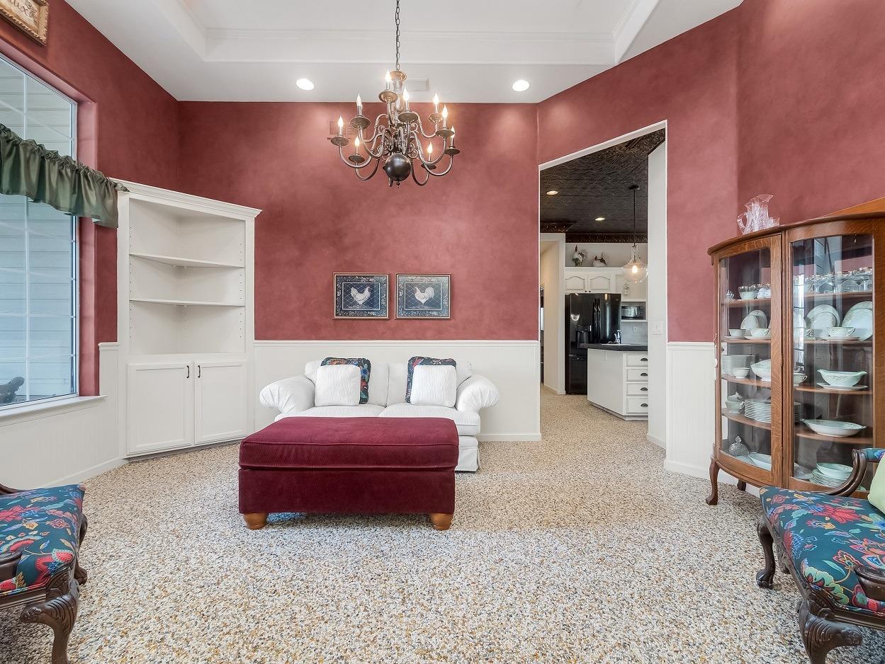 602 Fallbrook Avenue Clovis, CA 93611 - Photo 18 of 51 a bedroom with furniture and a chandelier