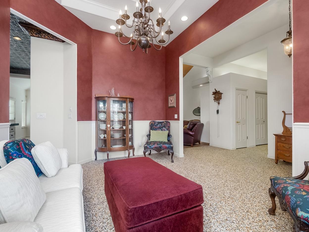 602 Fallbrook Avenue Clovis, CA 93611 - Photo 20 of 51 a bedroom with furniture and a chandelier