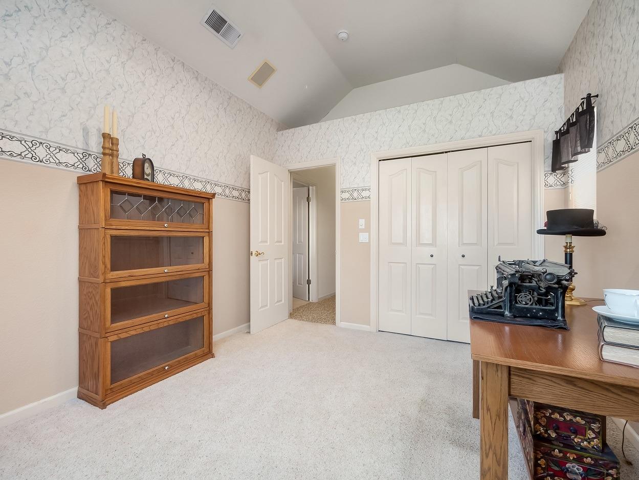 602 Fallbrook Avenue Clovis, CA 93611 - Photo 32 of 51 a living room with furniture and a fireplace