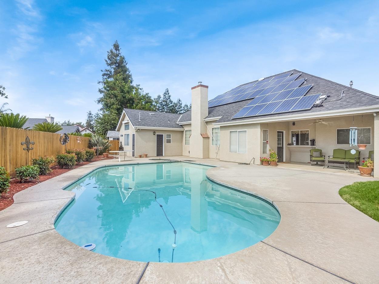 602 Fallbrook Avenue Clovis, CA 93611 - Photo 41 of 51 a view of a house with a swimming pool