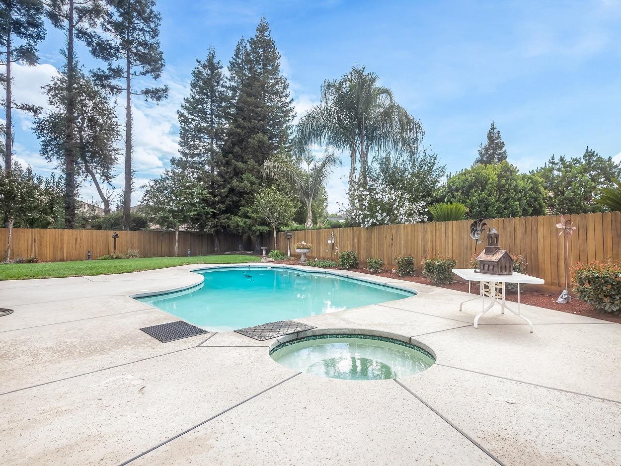 602 Fallbrook Avenue Clovis, CA 93611 - Photo 42 of 51 a view of a swimming pool with a patio