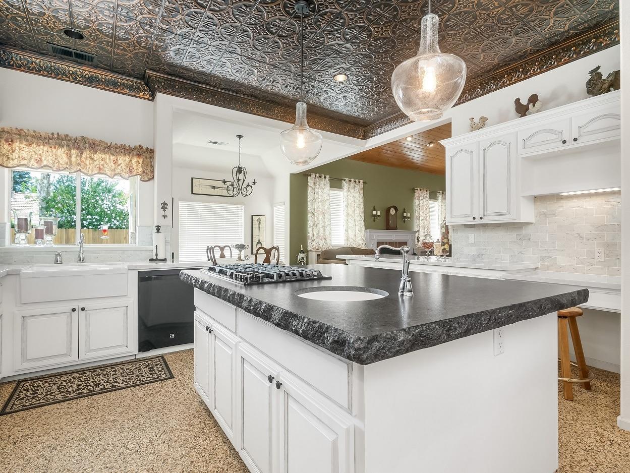 602 Fallbrook Avenue Clovis, CA 93611 - Photo 6 of 51 a kitchen with stainless steel appliances granite countertop a sink window and cabinets