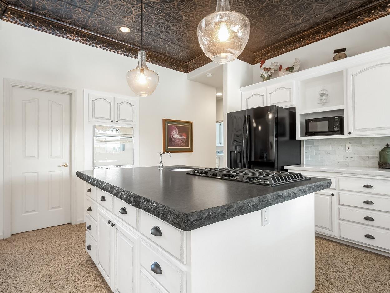 602 Fallbrook Avenue Clovis, CA 93611 - Photo 8 of 51 a kitchen with stainless steel appliances granite countertop a sink a refrigerator and a stove