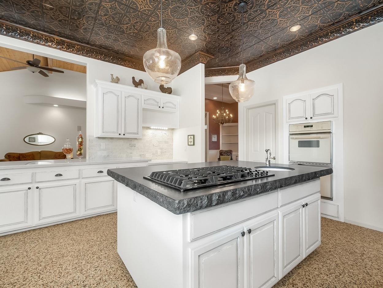 602 Fallbrook Avenue Clovis, CA 93611 - Photo 10 of 51 a kitchen with stainless steel appliances granite countertop a sink a stove and cabinets