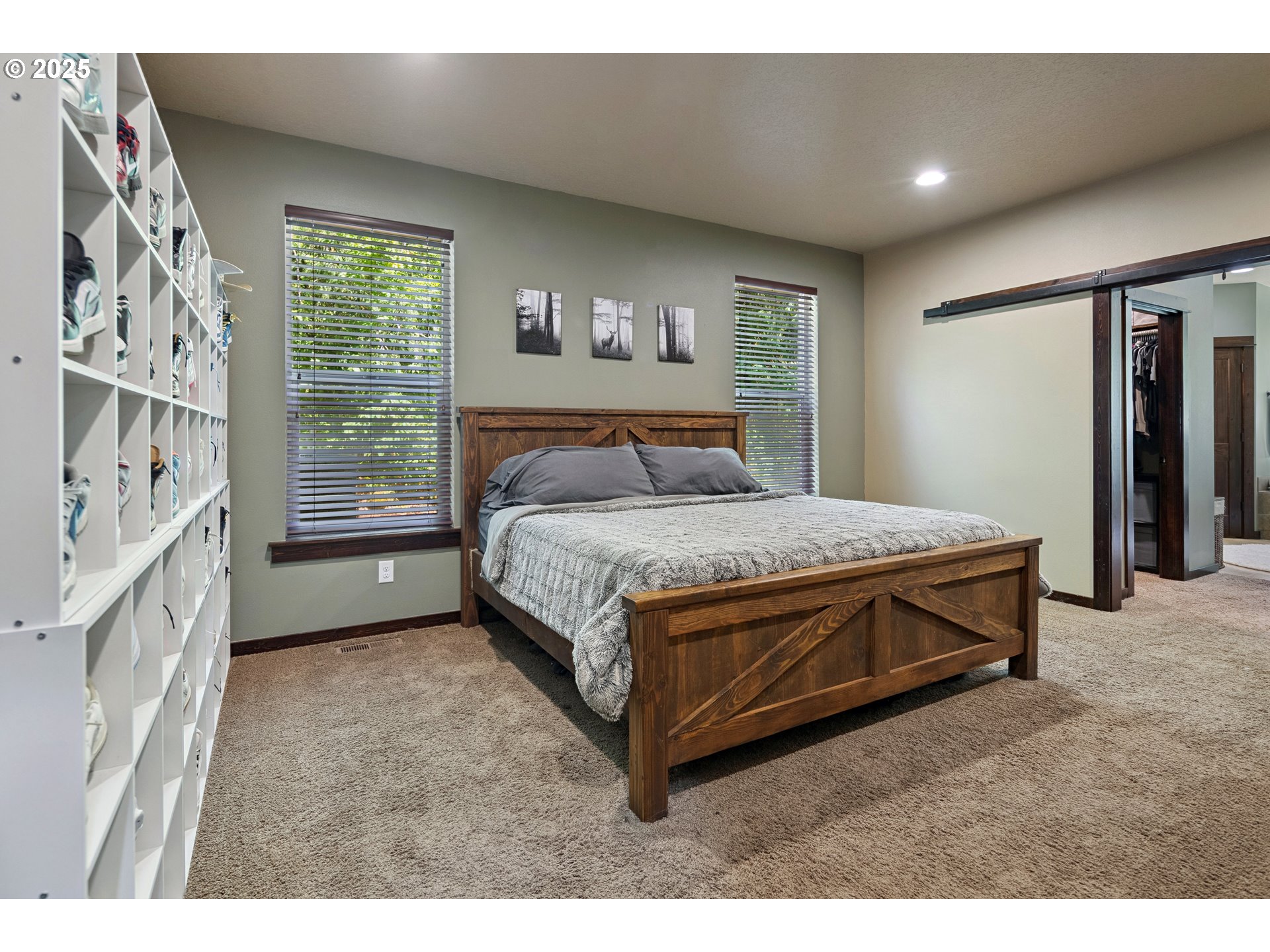 57214 East Marmot Road Sandy, OR 97055 - Photo 11 of 48 a bedroom with a bed and a large window