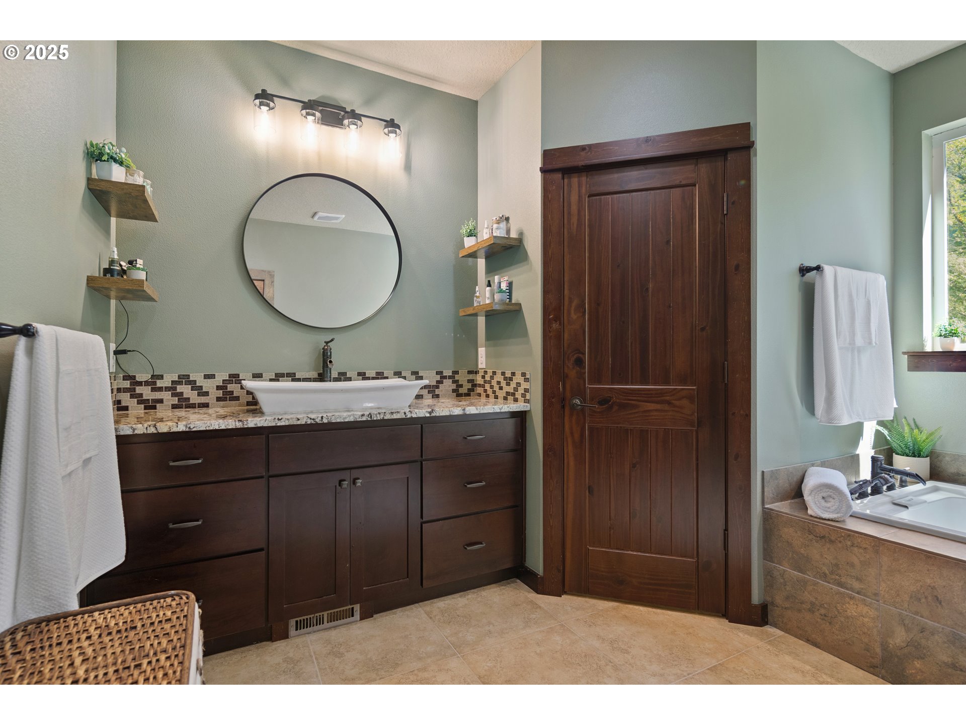 57214 East Marmot Road Sandy, OR 97055 - Photo 15 of 48 a bathroom with a sink a toilet and a mirror