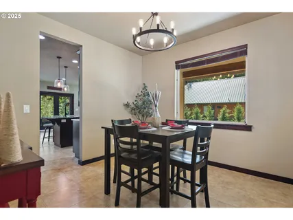 a view of a dining room with furniture and window