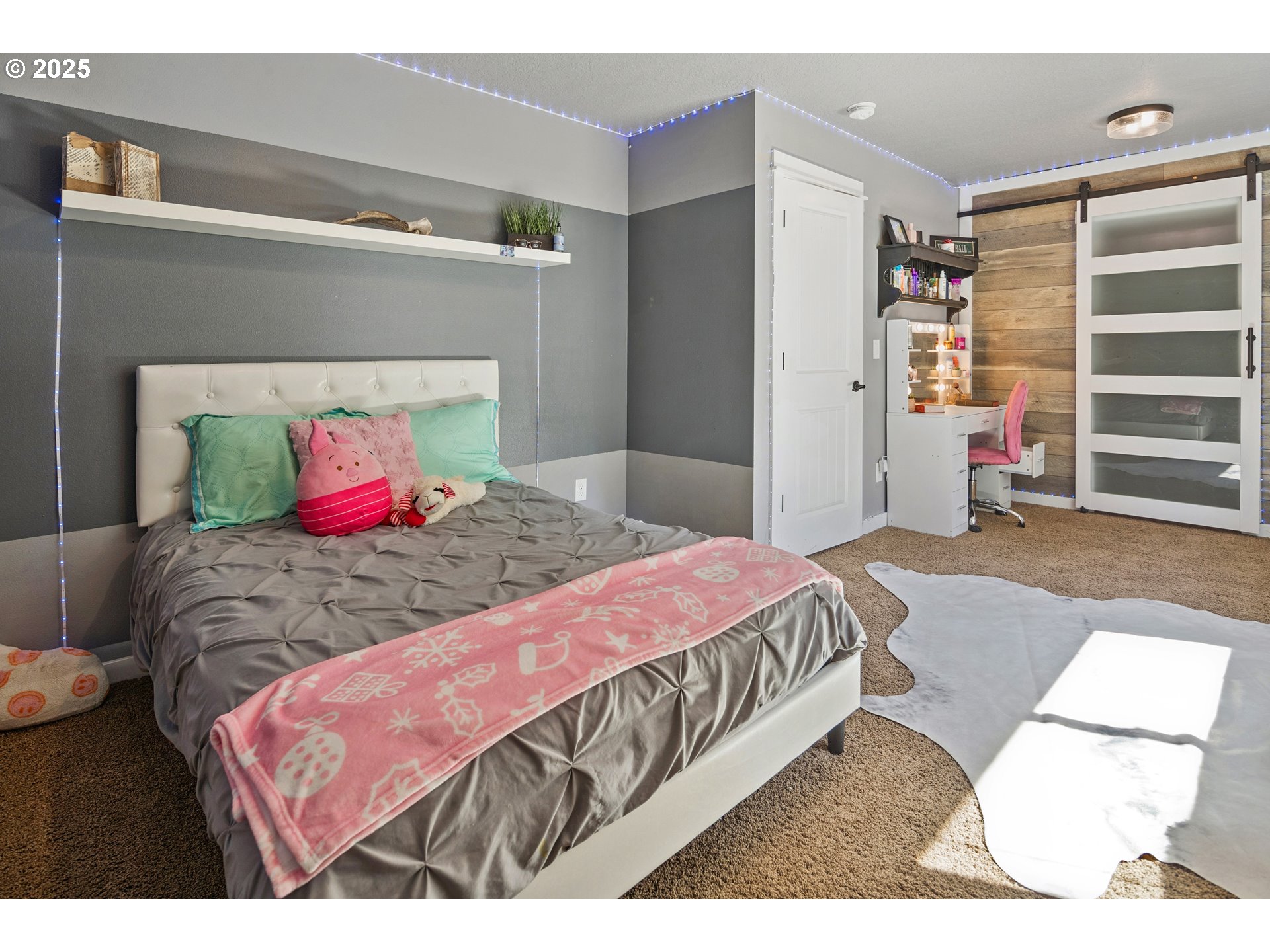 57214 East Marmot Road Sandy, OR 97055 - Photo 26 of 48 a bedroom with a bed and a mirror