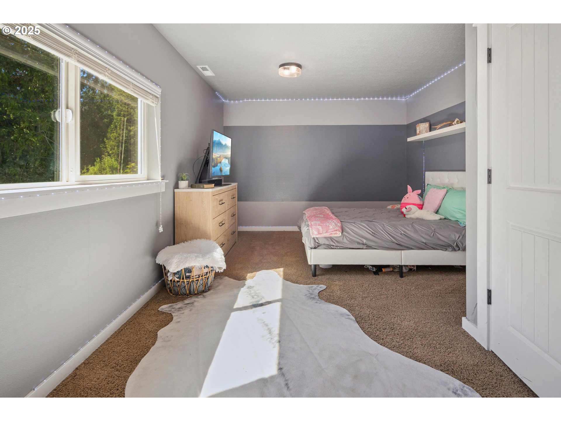 57214 East Marmot Road Sandy, OR 97055 - Photo 27 of 48 a bedroom with furniture and a window