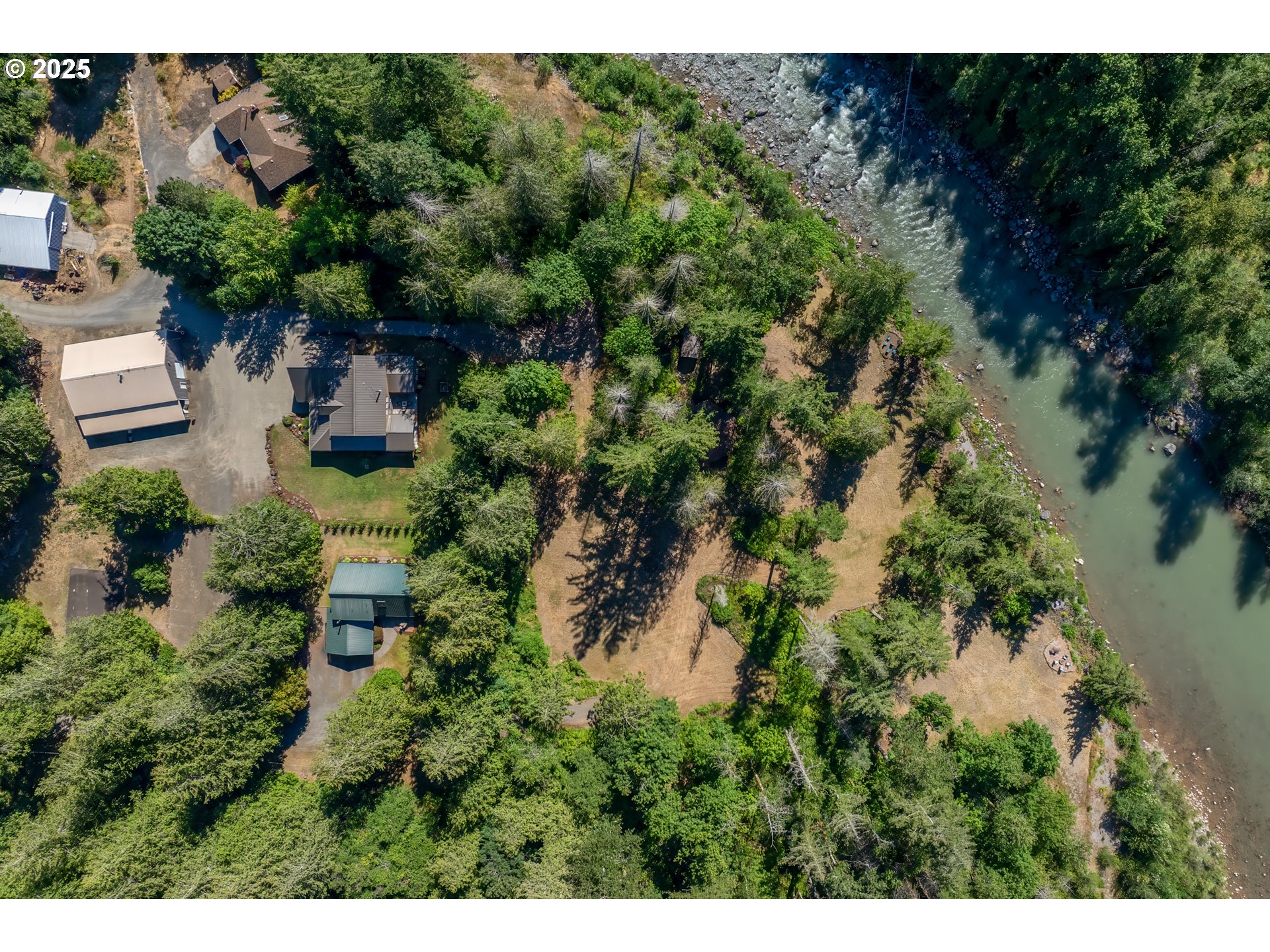 57214 East Marmot Road Sandy, OR 97055 - Photo 46 of 48 a view of a garden with a building