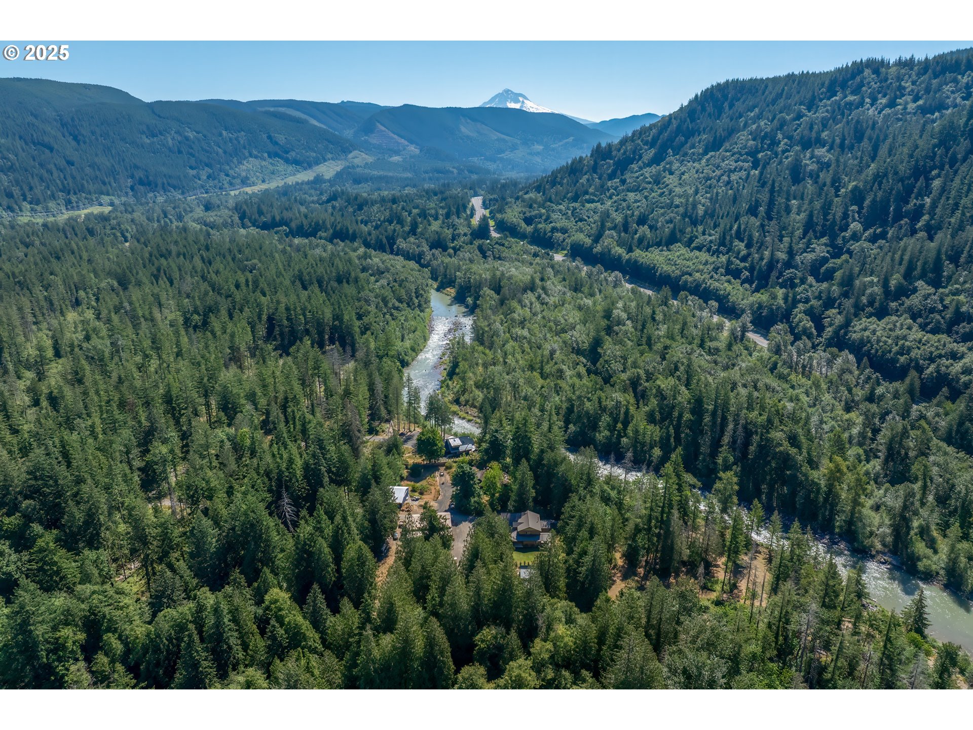 57214 East Marmot Road Sandy, OR 97055 - Photo 47 of 48 a view of a lush green hillside and a houses