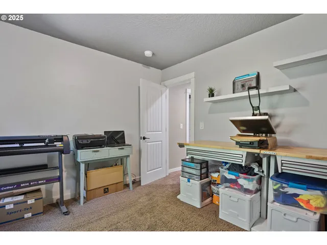 a kitchen with furniture and a stove top oven