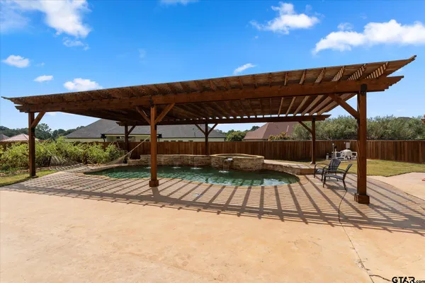a view of a outdoor space with swimming pool