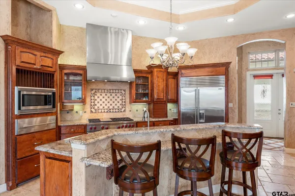 a kitchen with a table and chairs