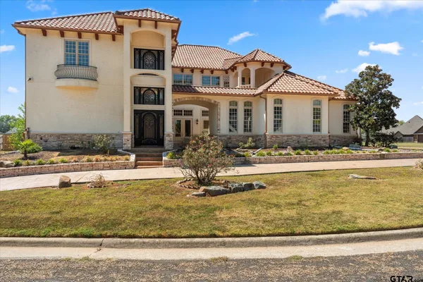 a front view of house with outdoor seating