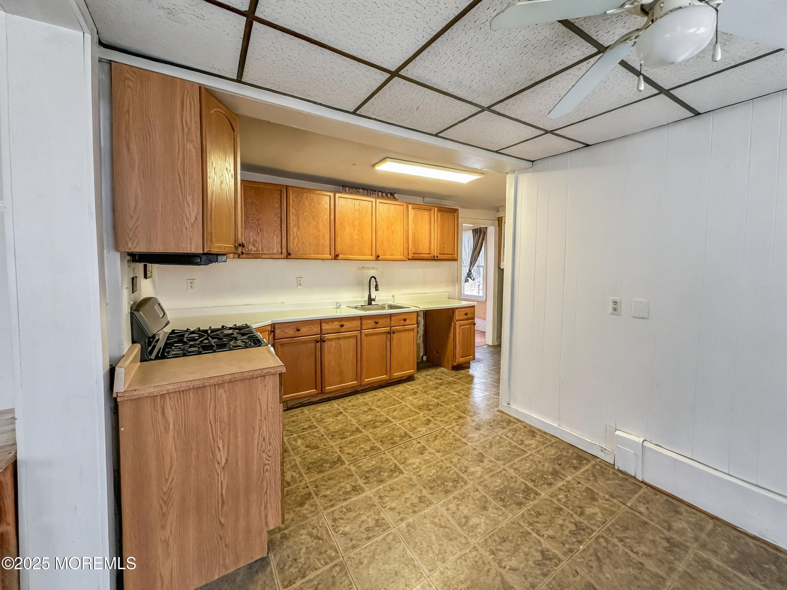 5 Pittenger Pond Road Freehold, NJ 07728 - Photo 5 of 20 a kitchen with a stove a sink and a refrigerator