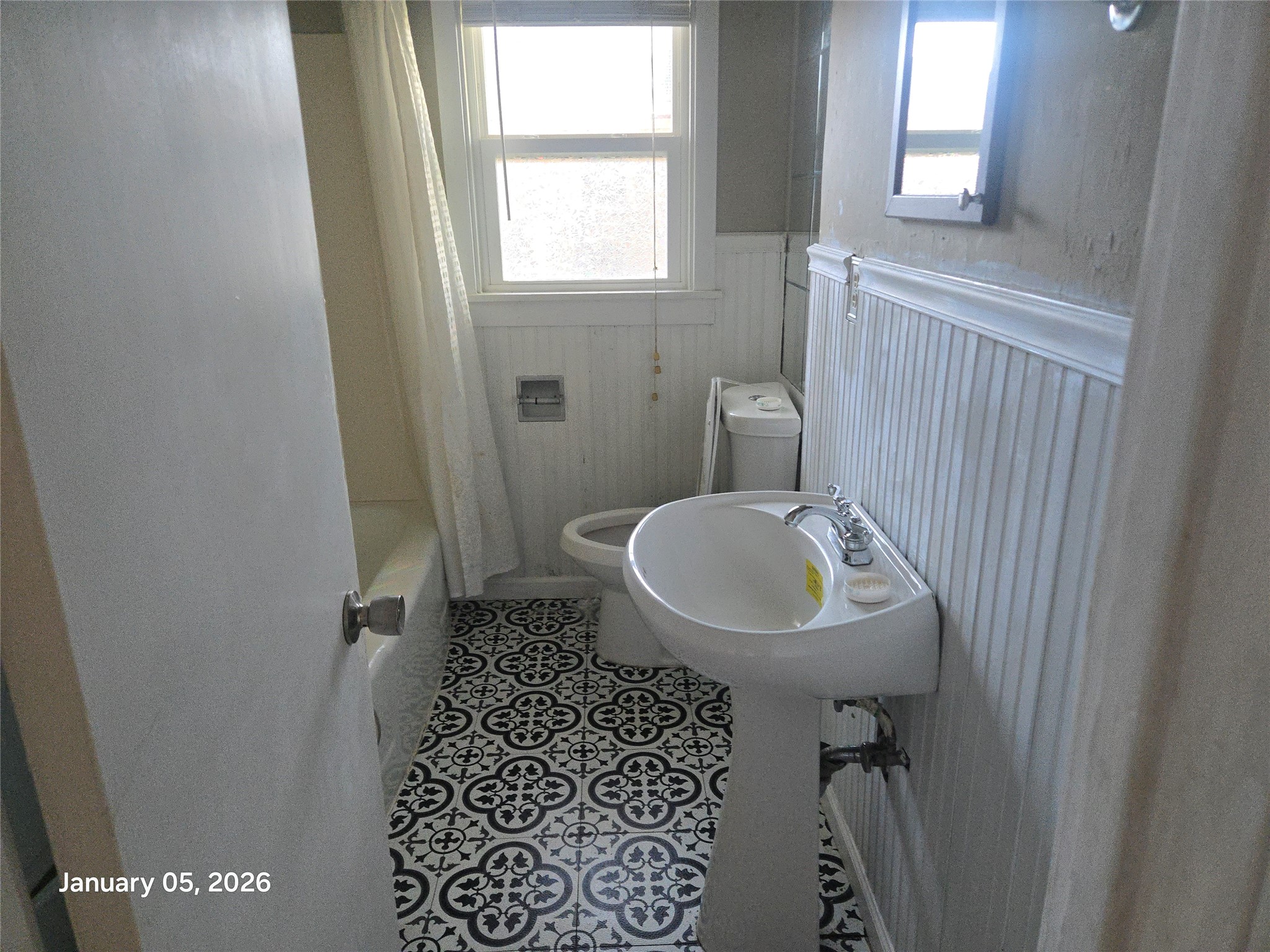 515 Breezy Lane Wharton, TX 77488 - Photo 14 of 18 a bathroom with a sink a toilet and a mirror