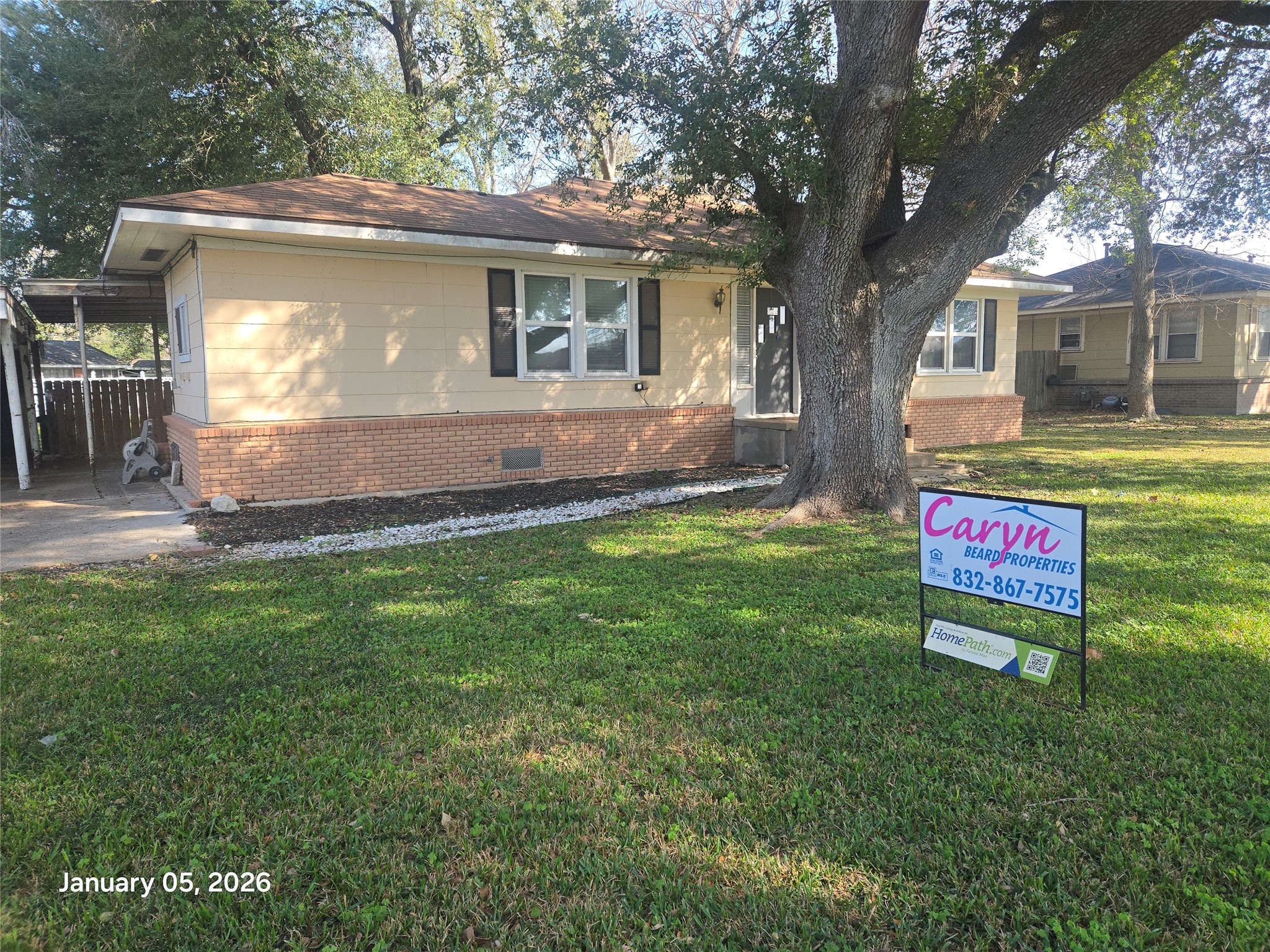 515 Breezy Lane Wharton, TX 77488 - Photo 16 of 18 a sign that is sitting in front of a house
