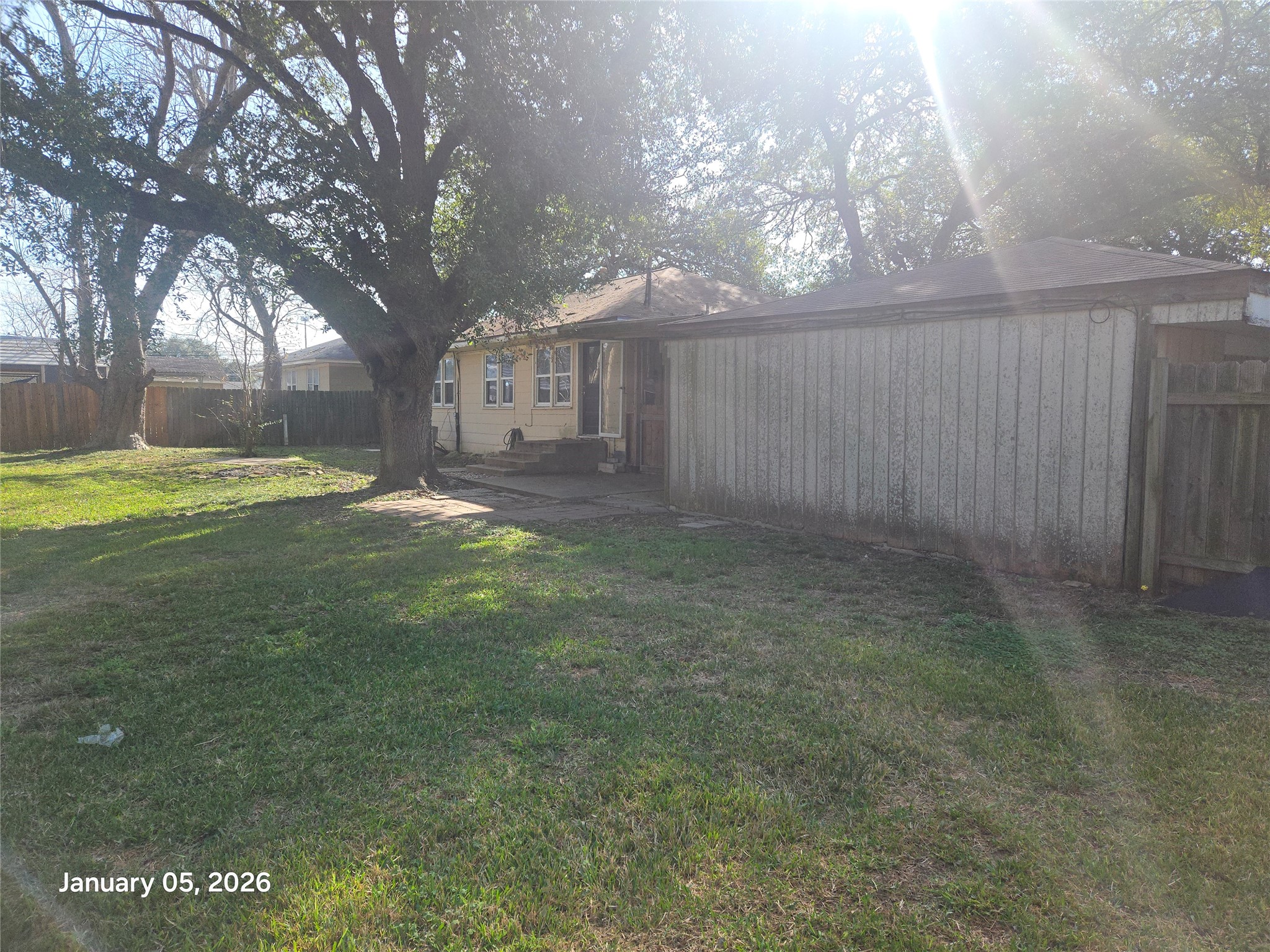 515 Breezy Lane Wharton, TX 77488 - Photo 6 of 18 a view of a yard with an trees