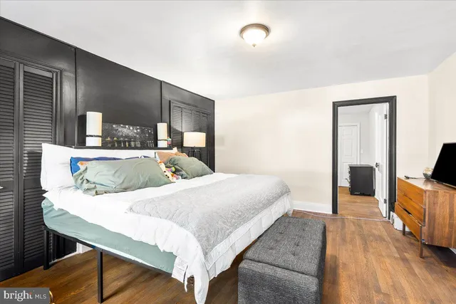 a large white bed in a white room