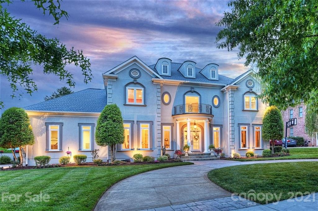 13710 Robert Walker Drive Davidson, NC 28036 - Photo 2 of 48 a front view of a brick building with a yard