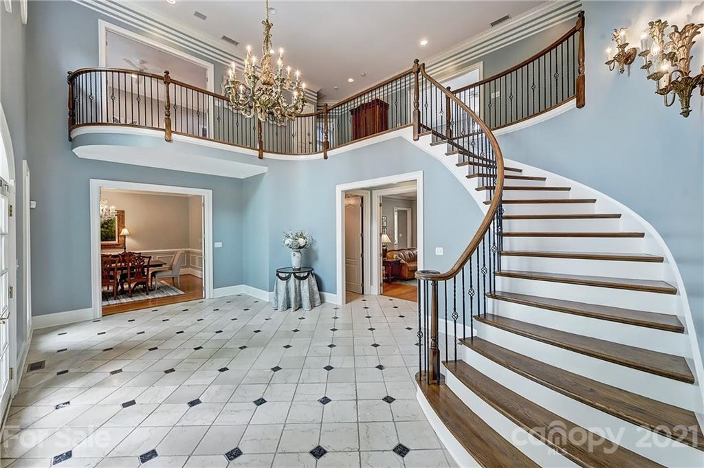 13710 Robert Walker Drive Davidson, NC 28036 - Photo 12 of 48 a view of a hallway with a chandelier and livingroom