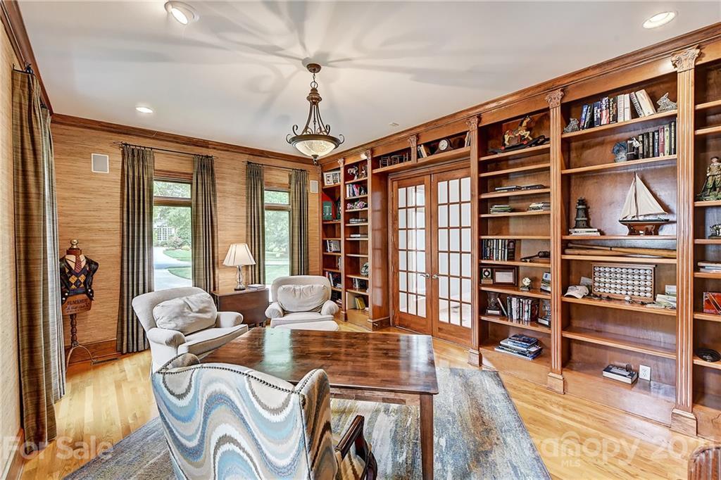 13710 Robert Walker Drive Davidson, NC 28036 - Photo 15 of 48 a living room with furniture and a book shelf