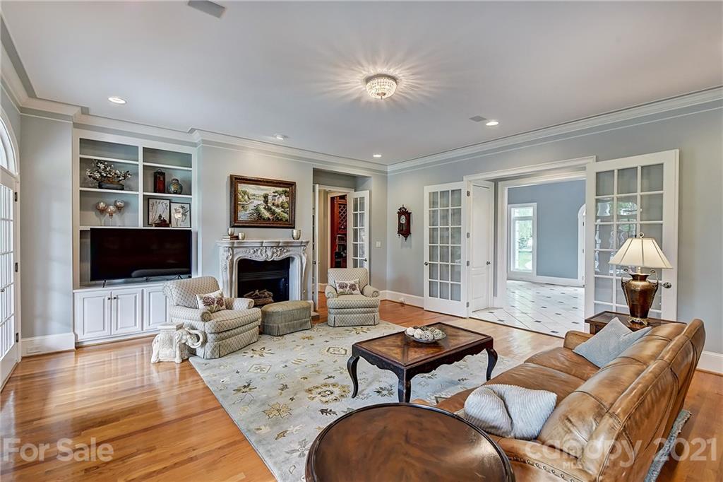13710 Robert Walker Drive Davidson, NC 28036 - Photo 18 of 48 a living room with furniture fireplace and flat screen tv