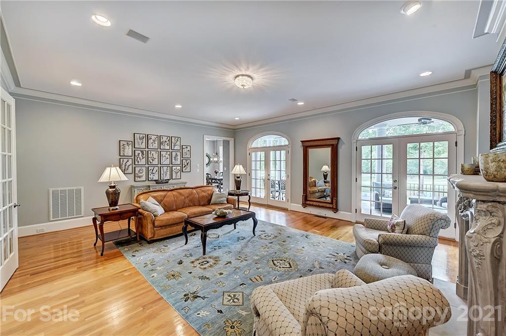 13710 Robert Walker Drive Davidson, NC 28036 - Photo 19 of 48 a living room with furniture and a large window