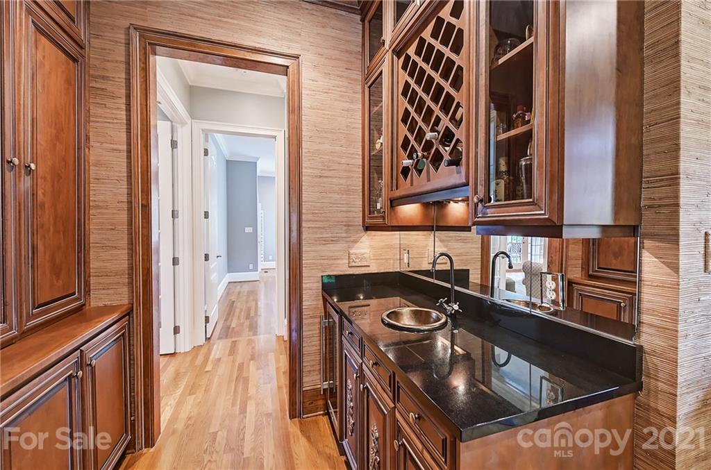 13710 Robert Walker Drive Davidson, NC 28036 - Photo 25 of 48 a kitchen with stainless steel appliances granite countertop a stove and a sink