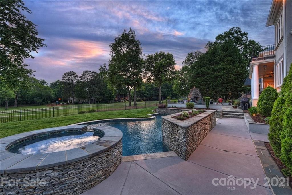 13710 Robert Walker Drive Davidson, NC 28036 - Photo 4 of 48 a view of a swimming pool with a patio