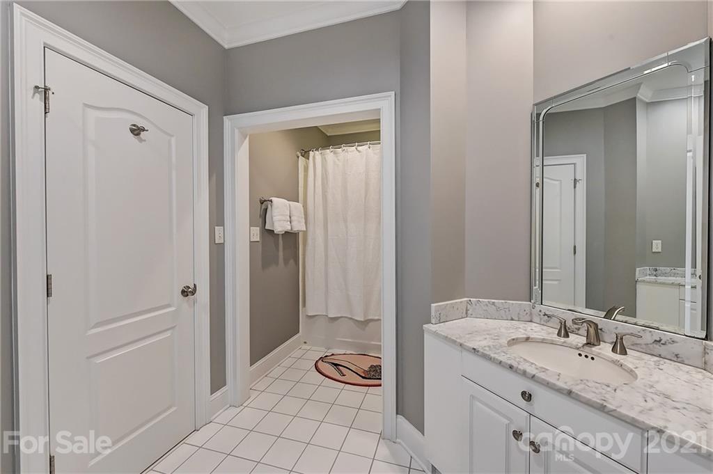 13710 Robert Walker Drive Davidson, NC 28036 - Photo 36 of 48 a bathroom with a granite countertop sink and a mirror