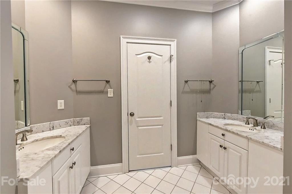 13710 Robert Walker Drive Davidson, NC 28036 - Photo 37 of 48 a spacious bathroom with a double vanity sink mirror and double