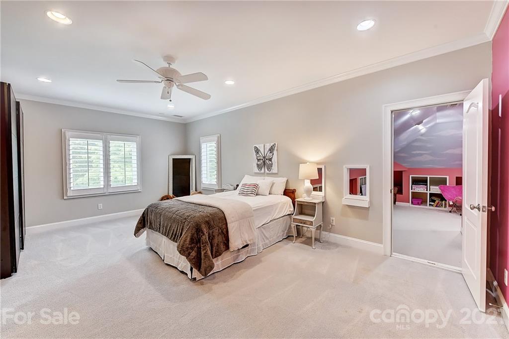 13710 Robert Walker Drive Davidson, NC 28036 - Photo 38 of 48 a spacious bedroom with a bed and window