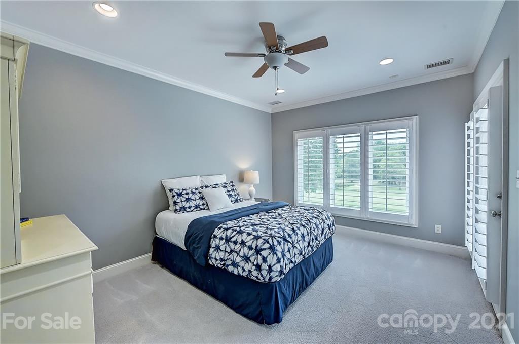 13710 Robert Walker Drive Davidson, NC 28036 - Photo 40 of 48 a bedroom with a bed and a window
