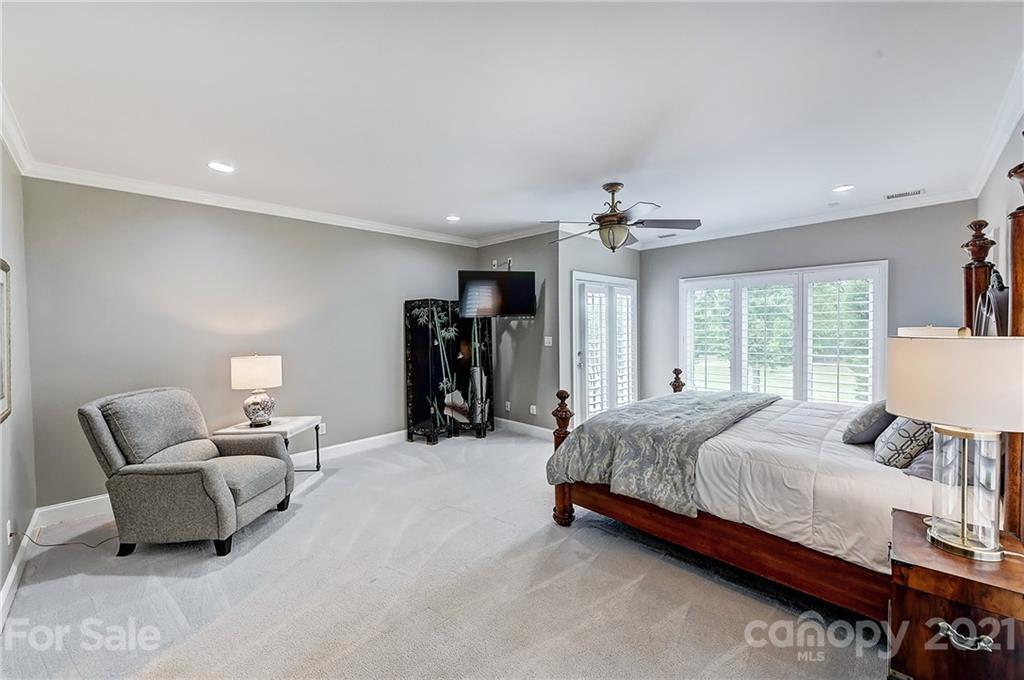 13710 Robert Walker Drive Davidson, NC 28036 - Photo 43 of 48 a spacious bedroom with a bed and a couch
