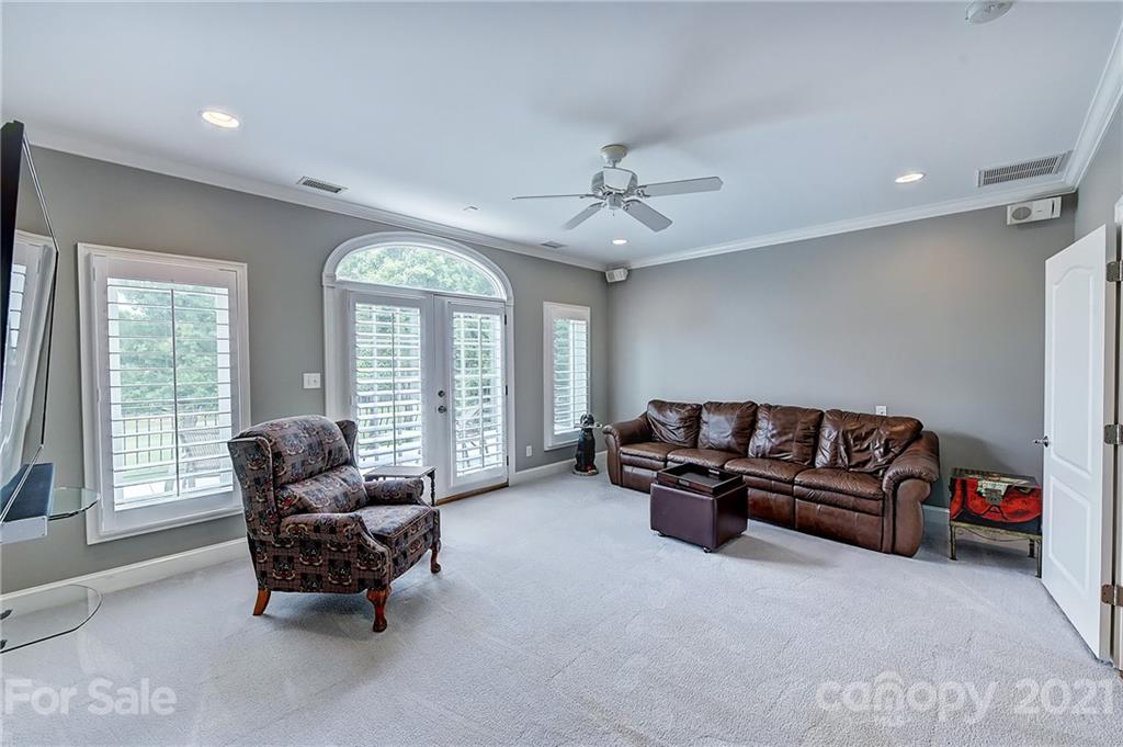 13710 Robert Walker Drive Davidson, NC 28036 - Photo 46 of 48 a living room with furniture and large windows