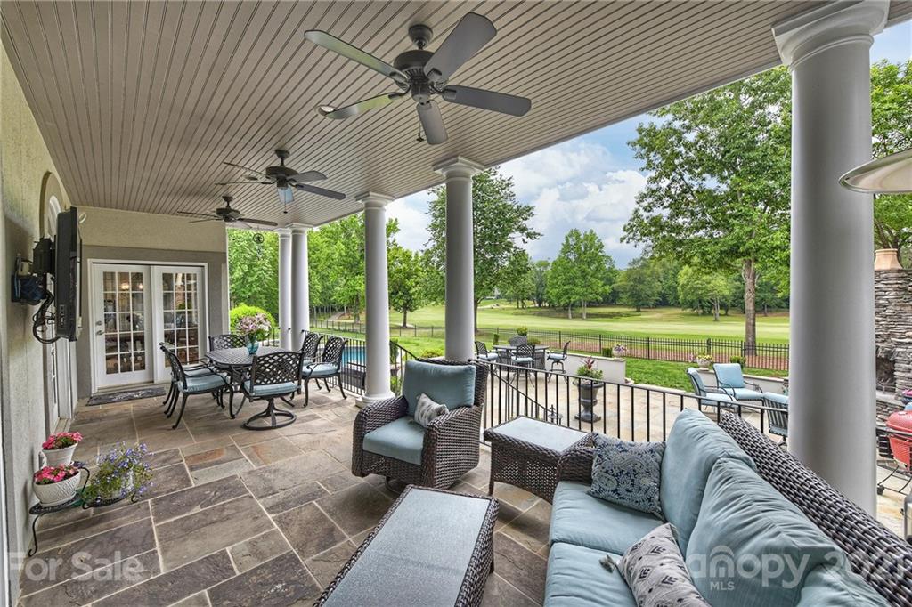 13710 Robert Walker Drive Davidson, NC 28036 - Photo 47 of 48 a living room with furniture and a floor to ceiling window