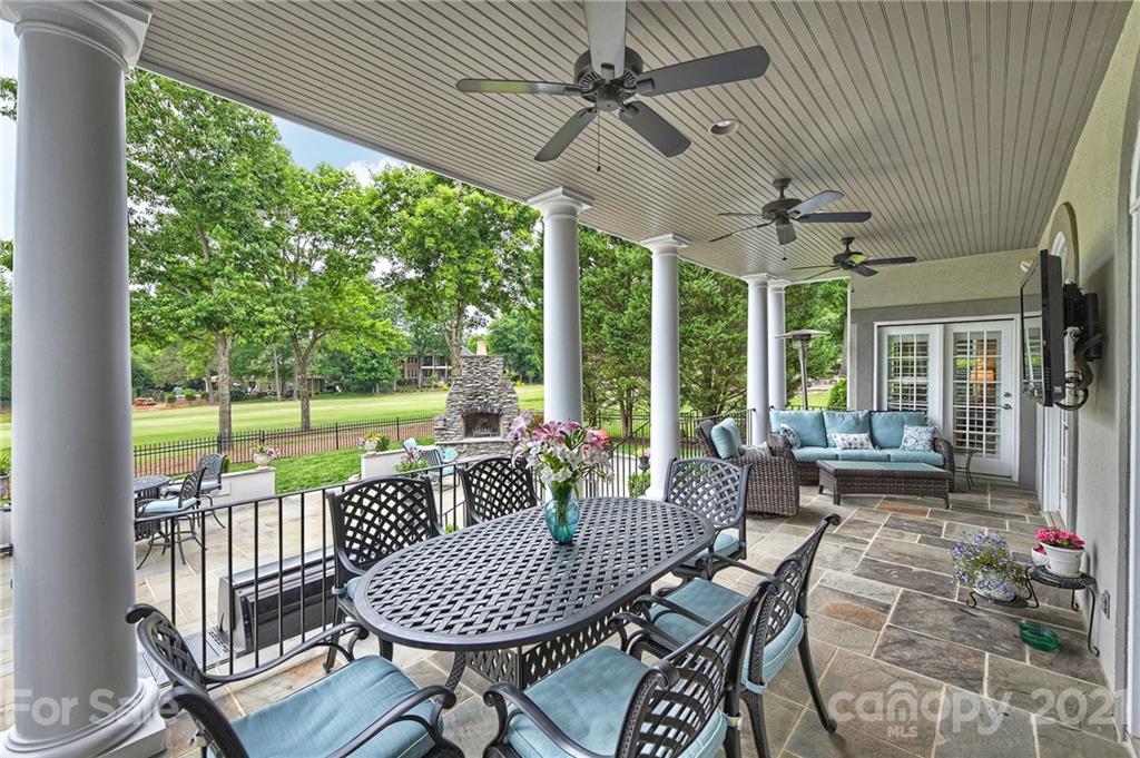 13710 Robert Walker Drive Davidson, NC 28036 - Photo 48 of 48 a view of a porch with furniture and a yard