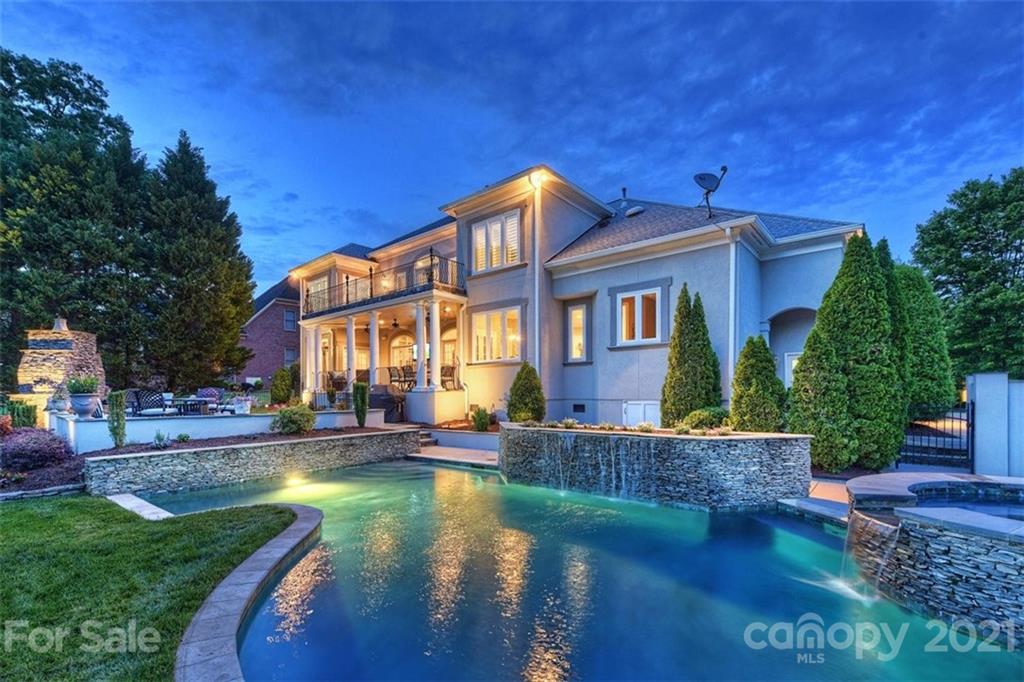 13710 Robert Walker Drive Davidson, NC 28036 - Photo 7 of 48 a view of a house with pool and chairs