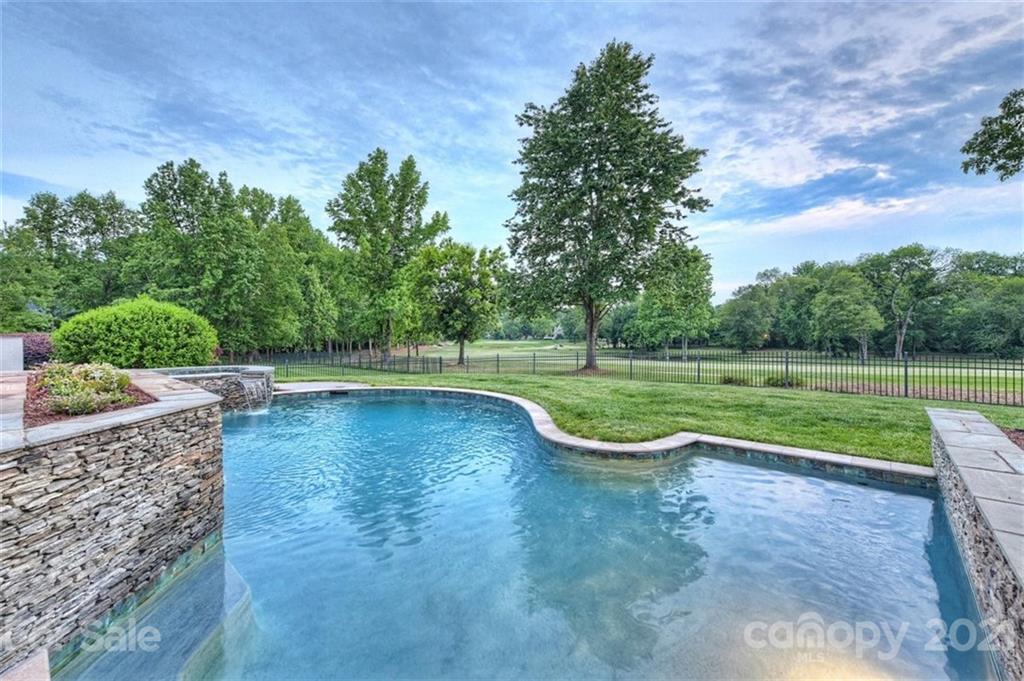 13710 Robert Walker Drive Davidson, NC 28036 - Photo 9 of 48 a view of a swimming pool with a yard