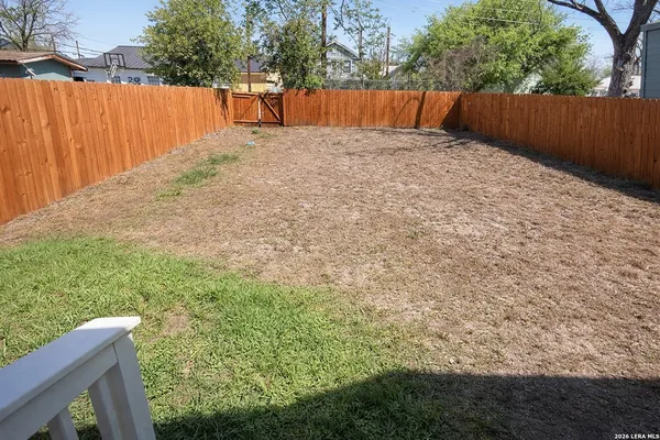 a view of backyard with tree