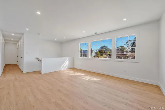 a view of an empty room with glass door
