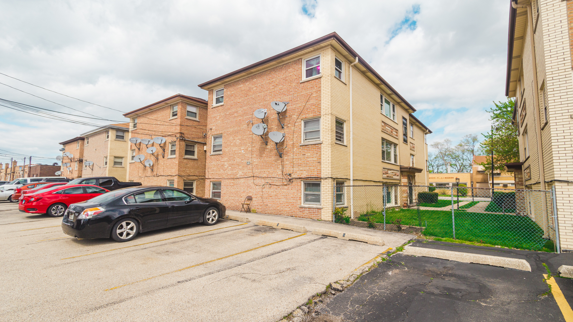 7418 North Harlem Avenue, Unit 2 Chicago, IL 60631 - Photo 9 of 10 a car parked in front of a building