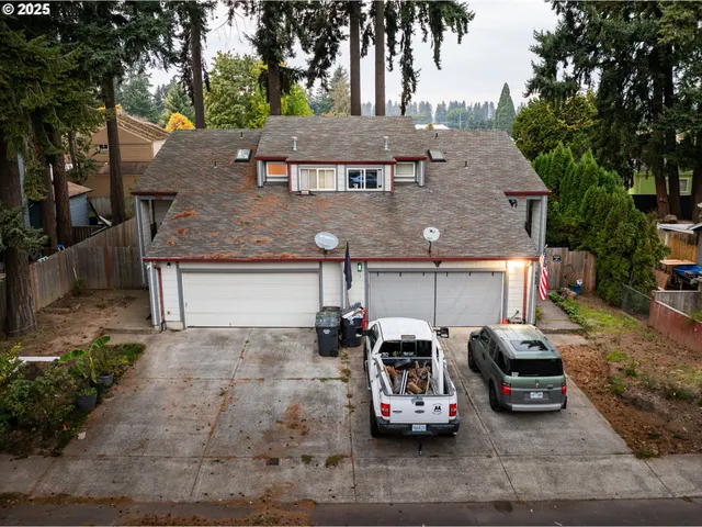 a view of a car parked in front of a house